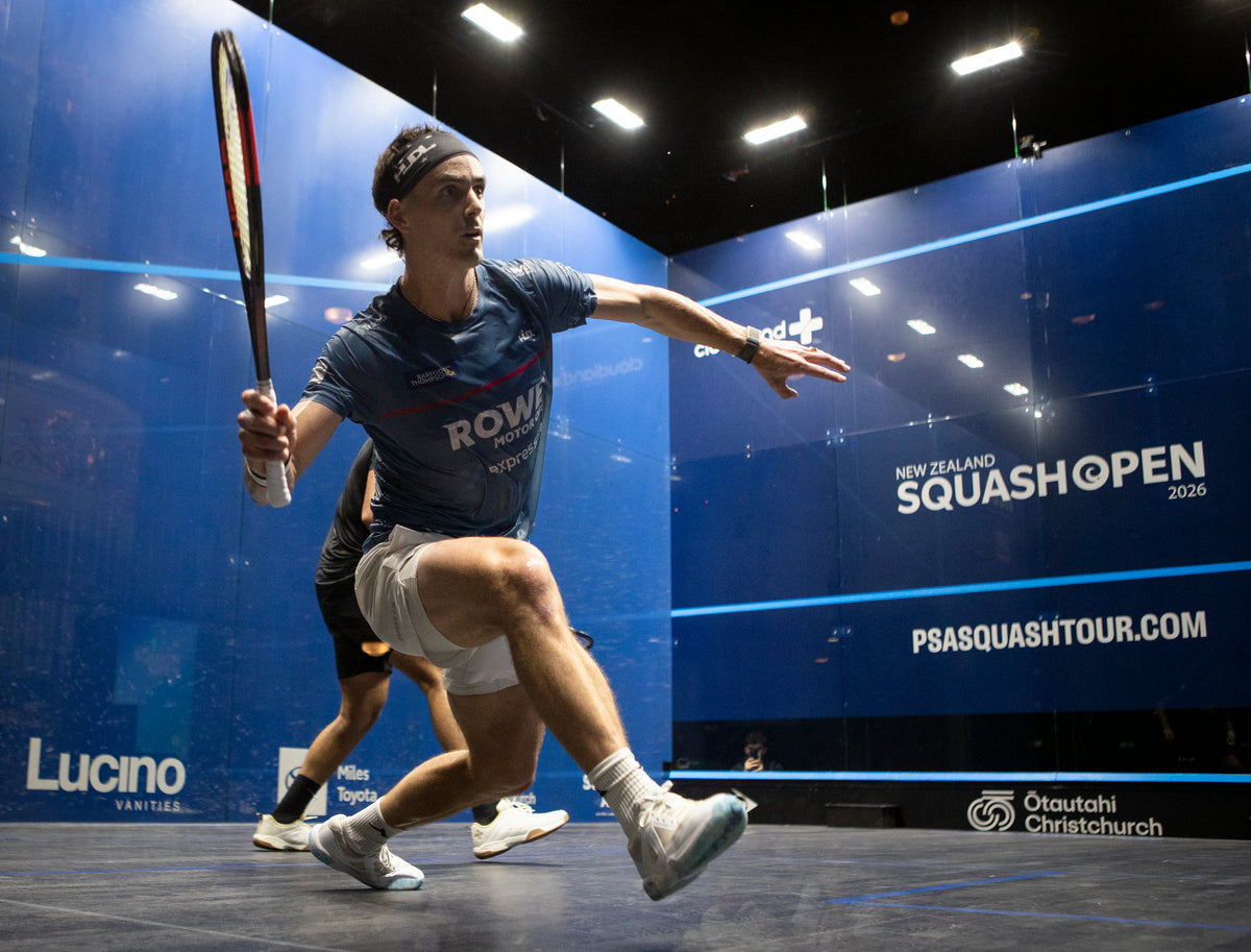Paul Coll in action during a match at the New Zealand Squash Open 2026 event. Wearing his Superman Provincial Blue Tournament T shirt