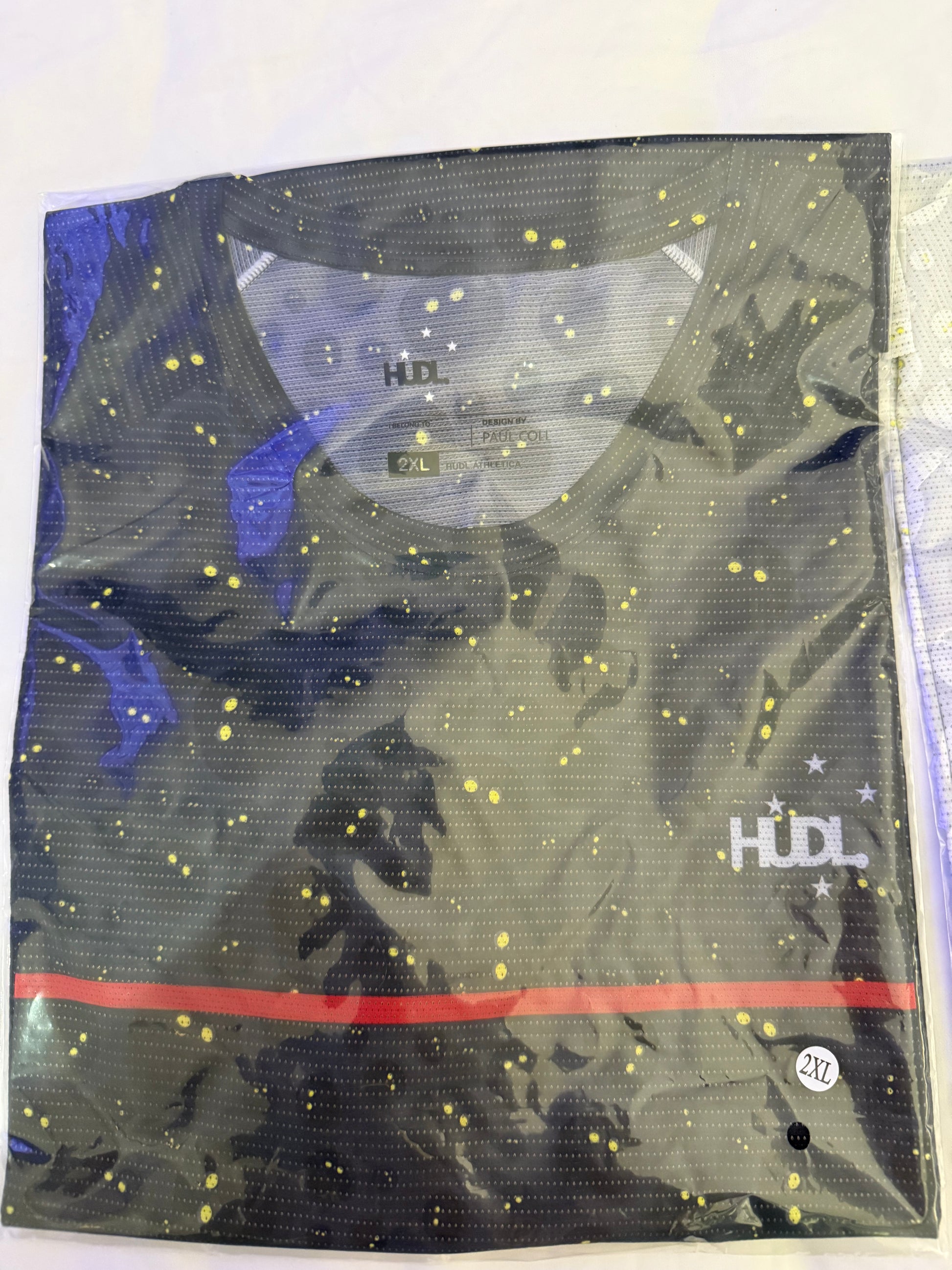 HUDL Rally in Motion limited edition squash tee – XTPro silver infused performance fabric, unique graphic design in black with double yellow squash balls 