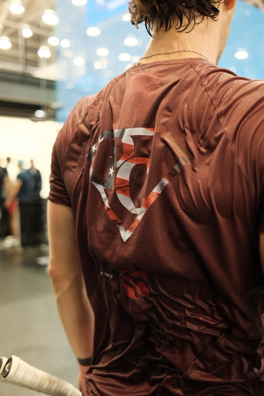 Paul Coll Superman limited edition squash shirt –  XTPro performance fabric in Burgundy showing the superman logo 